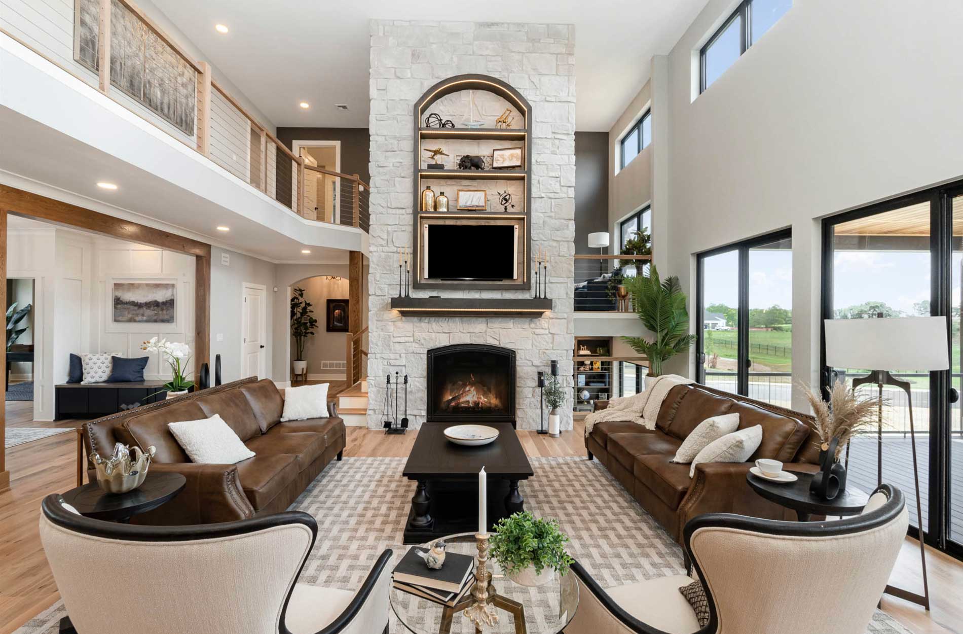Living Room with a White Stone Veneer Fireplace