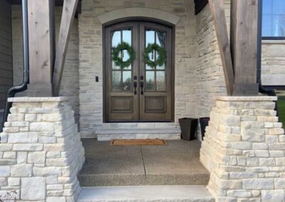 An exterior front entry way and porch featuring Bianco Blend