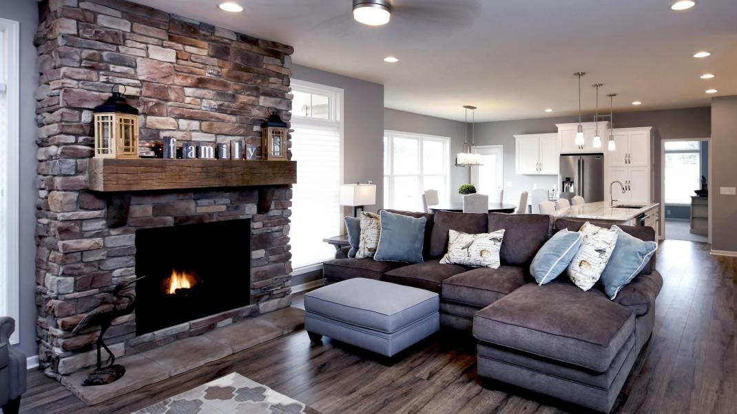 Living room featuring stone veneer fireplace