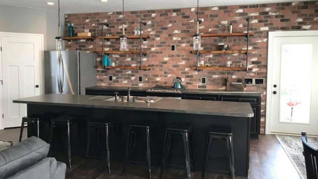 Kitchen with an interior stone accent wall