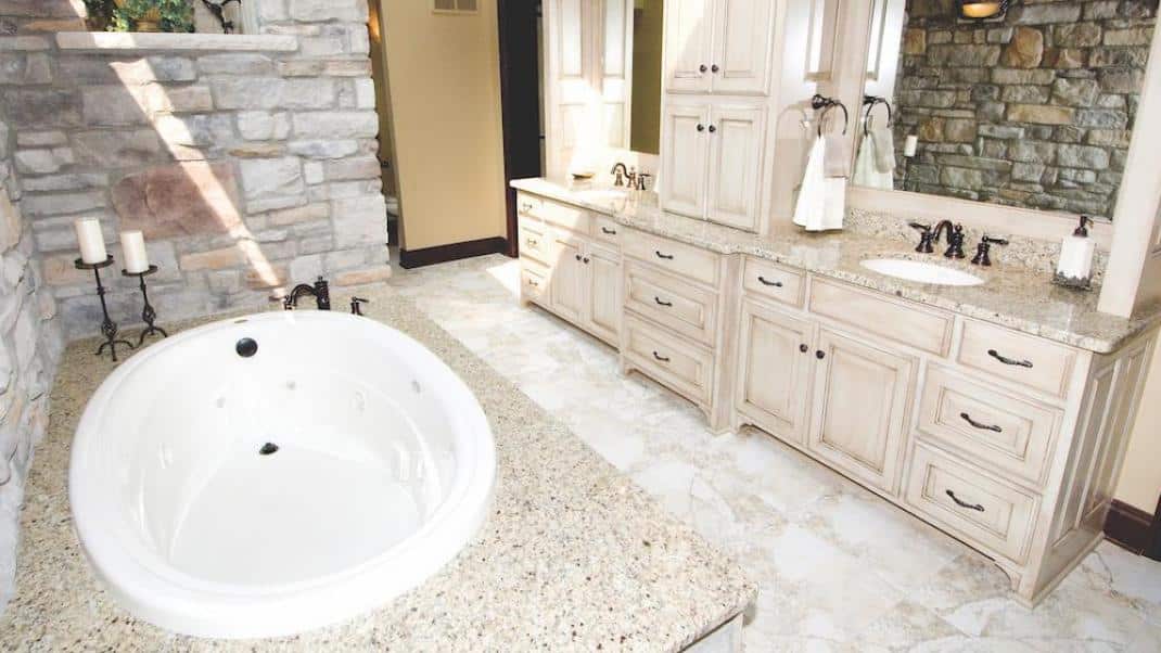 Bathroom featuring stone veener walls