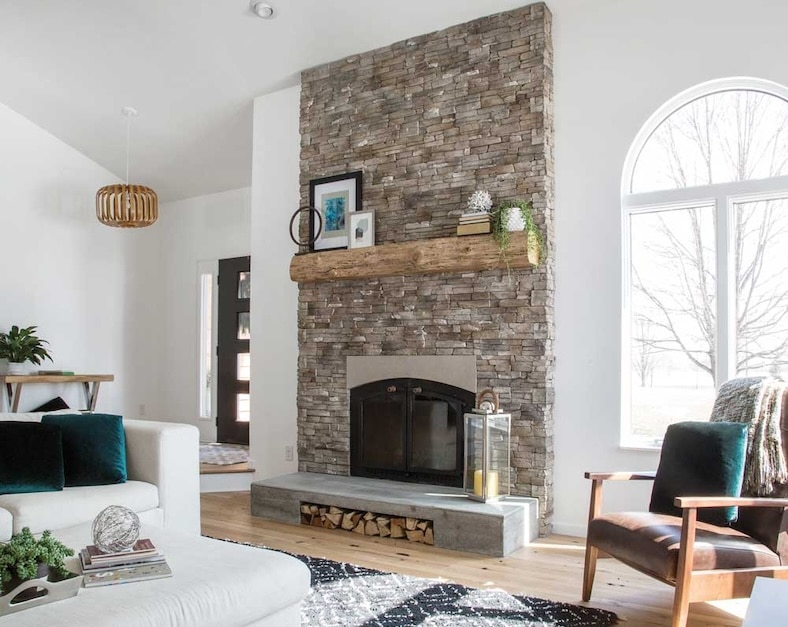 Casa di Sassi Matera Kwik Stack fireplace with a wooden mantel